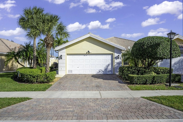 view of front of property with a garage