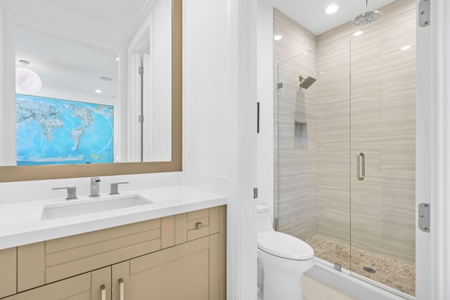 bathroom with a shower with shower door, vanity, and toilet