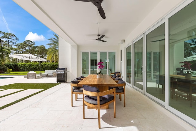 view of patio / terrace with ceiling fan and a grill