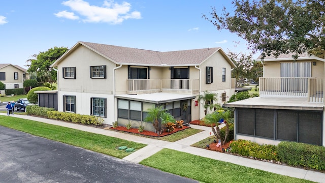 view of front of house with a balcony