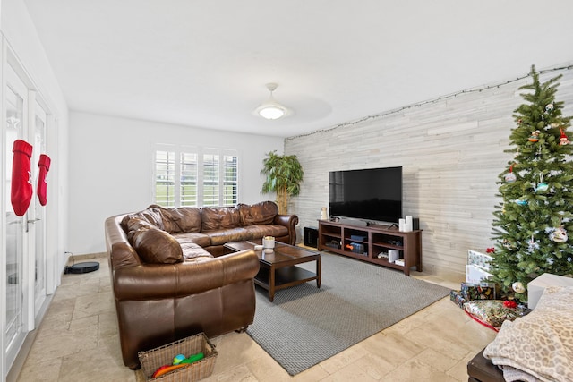 living room with wood walls