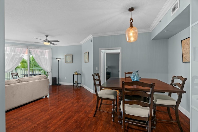 dining area with dark hardwood / wood-style flooring, ceiling fan, and crown molding