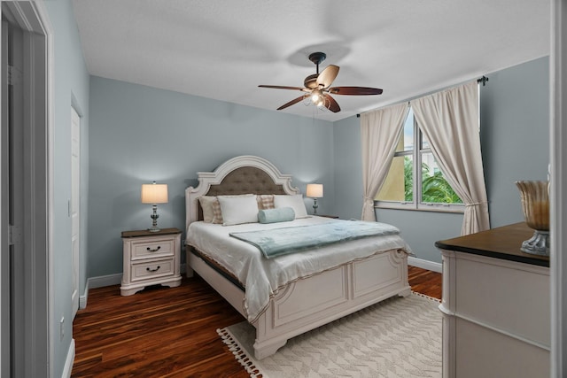 bedroom featuring ceiling fan and dark wood-type flooring