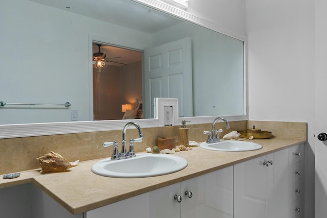 bathroom with backsplash, ceiling fan, and vanity