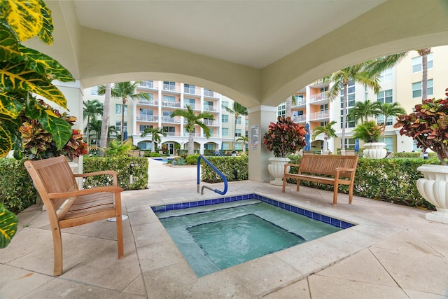 view of pool with a community hot tub