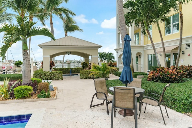 view of property's community featuring a gazebo and a patio