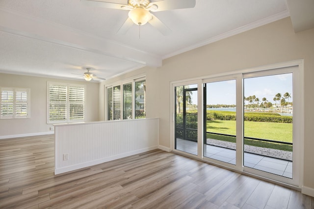 spare room with a healthy amount of sunlight and light hardwood / wood-style flooring