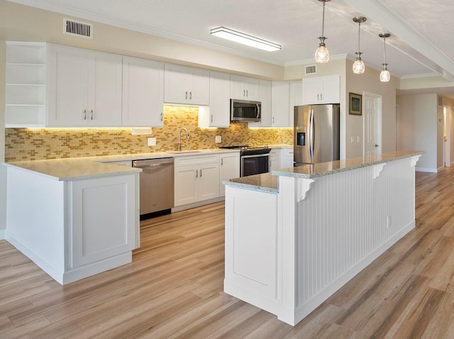 kitchen featuring sink, stainless steel appliances, crown molding, white cabinets, and light wood-type flooring