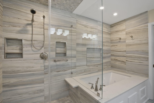 bathroom featuring separate shower and tub