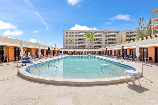 view of swimming pool with a patio