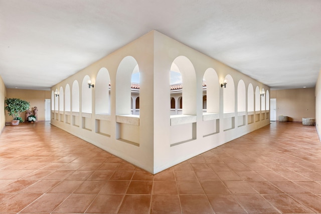 hall featuring tile patterned flooring