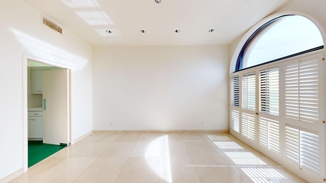 empty room with light tile patterned flooring