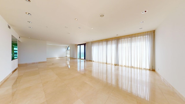 unfurnished room featuring light tile patterned flooring