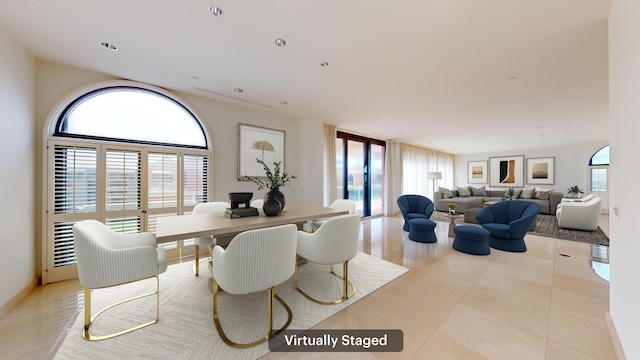 dining room featuring light tile patterned flooring and plenty of natural light