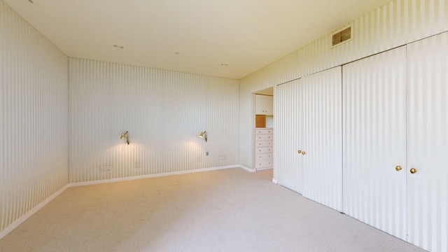 unfurnished bedroom featuring light colored carpet