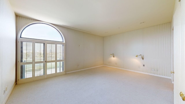 empty room featuring light carpet