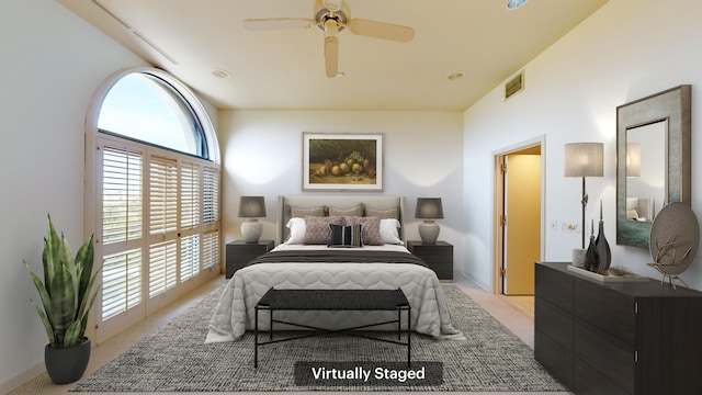 bedroom with light carpet and ceiling fan