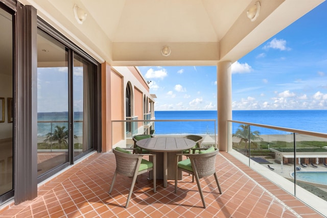 balcony featuring a water view