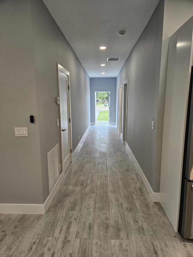 hallway featuring light hardwood / wood-style floors