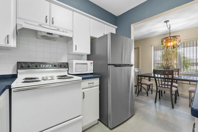 kitchen with tasteful backsplash, white appliances, decorative light fixtures, white cabinetry, and an inviting chandelier