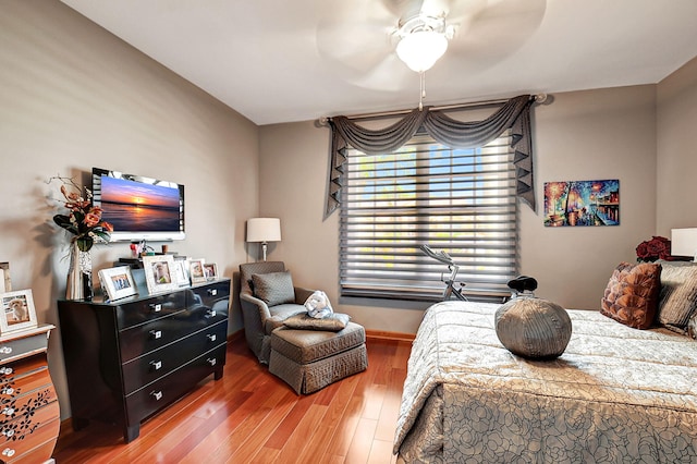 bedroom with hardwood / wood-style flooring and ceiling fan