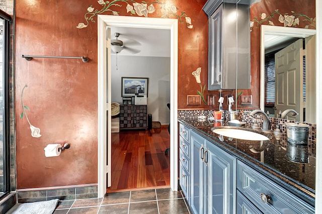 bathroom with vanity, ceiling fan, and wood-type flooring