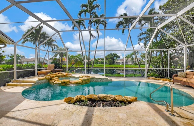 view of pool with a patio, a water view, and a lanai