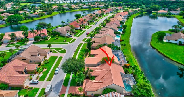 birds eye view of property featuring a water view