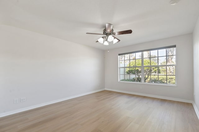 unfurnished room featuring ceiling fan and light wood-type flooring