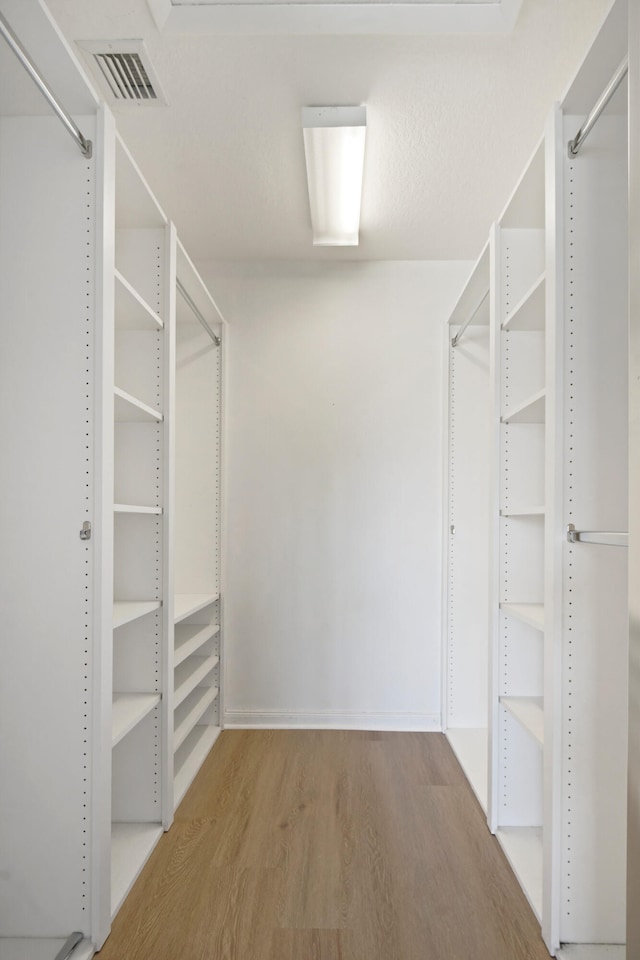 walk in closet featuring light wood-type flooring