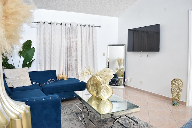 living room featuring tile patterned floors and a textured ceiling