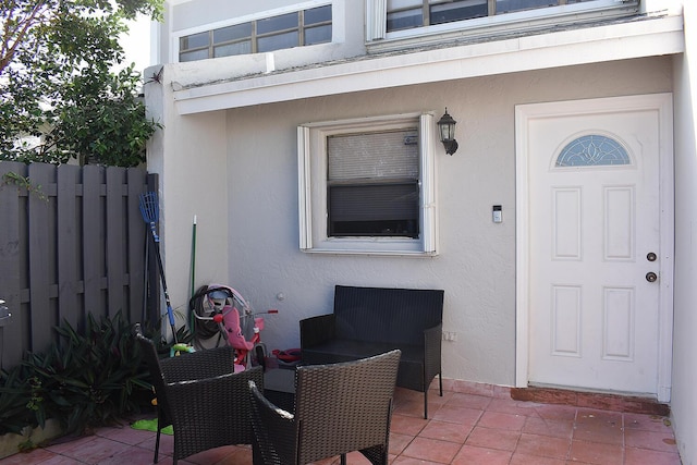 doorway to property with a patio area