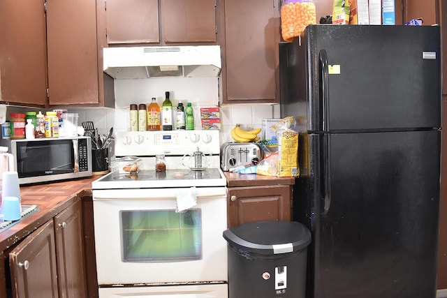 kitchen with white range with electric stovetop, backsplash, and black fridge