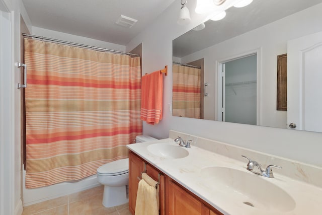 full bathroom with tile patterned flooring, vanity, shower / bath combination with curtain, and toilet