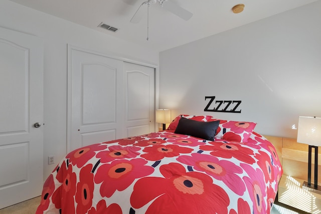 bedroom featuring carpet, ceiling fan, and a closet