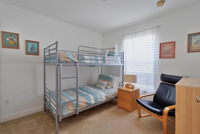 bedroom featuring carpet