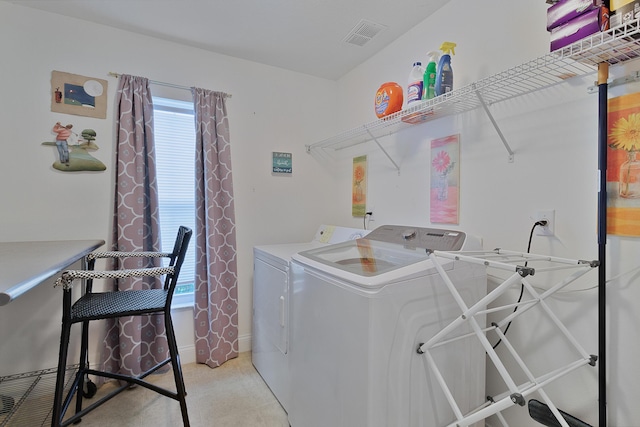 washroom with independent washer and dryer