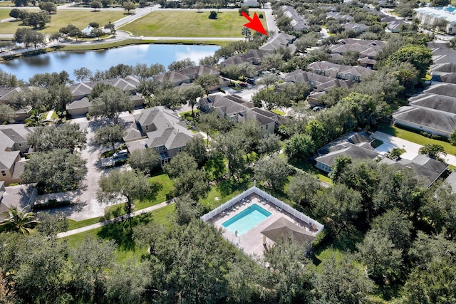 birds eye view of property featuring a water view