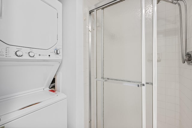 laundry room with stacked washing maching and dryer