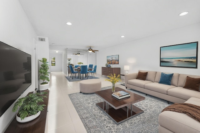 living room featuring ceiling fan and light tile patterned floors