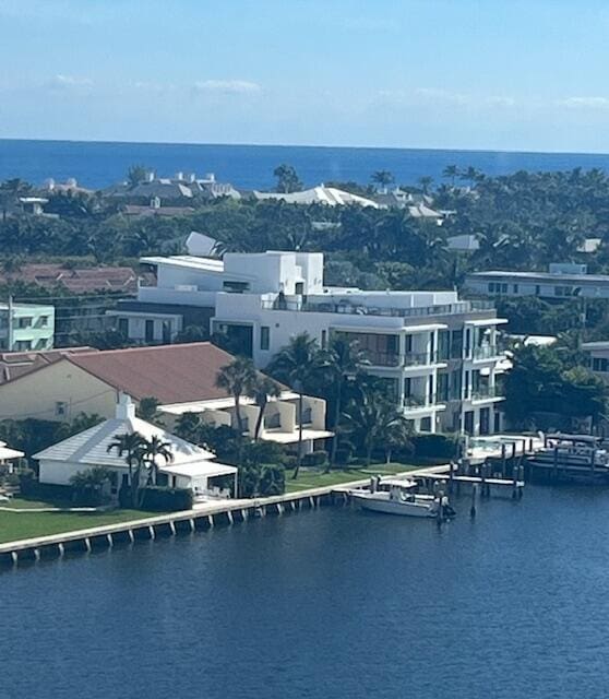 birds eye view of property with a water view