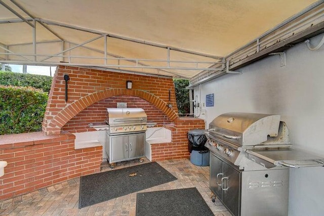 view of patio / terrace featuring area for grilling and a grill