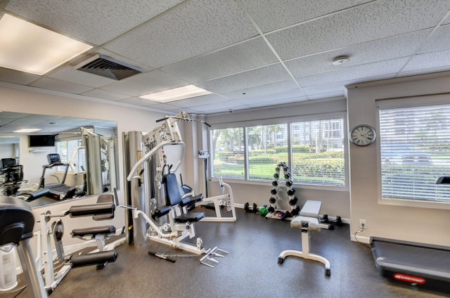 workout area featuring a drop ceiling