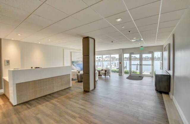 workout area with a paneled ceiling