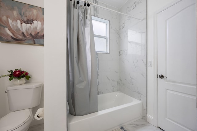 bathroom with shower / tub combo and toilet