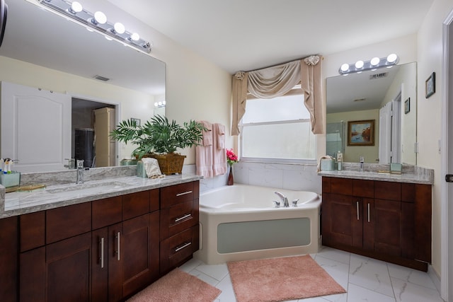 bathroom featuring a tub and vanity