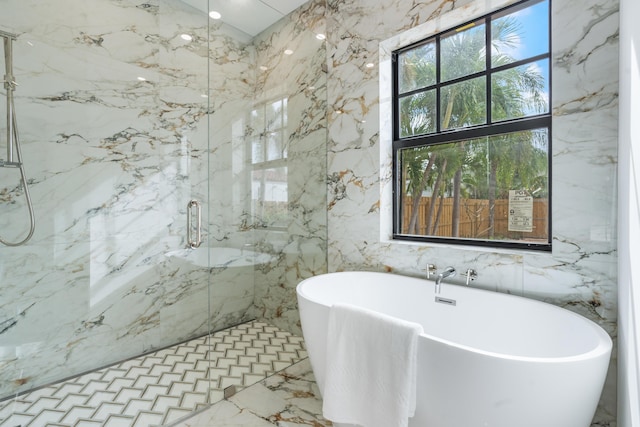 bathroom with tile walls and plus walk in shower