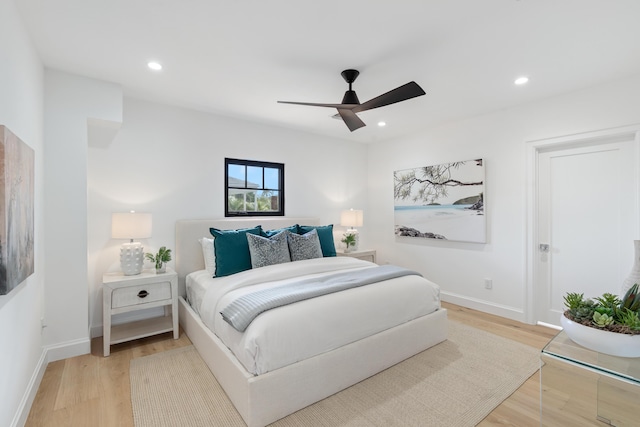 bedroom featuring ceiling fan and hardwood / wood-style flooring