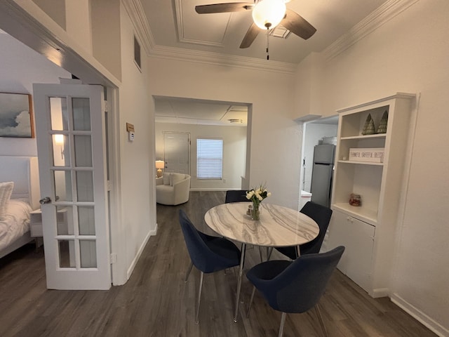 dining area with ceiling fan, crown molding, and dark hardwood / wood-style floors