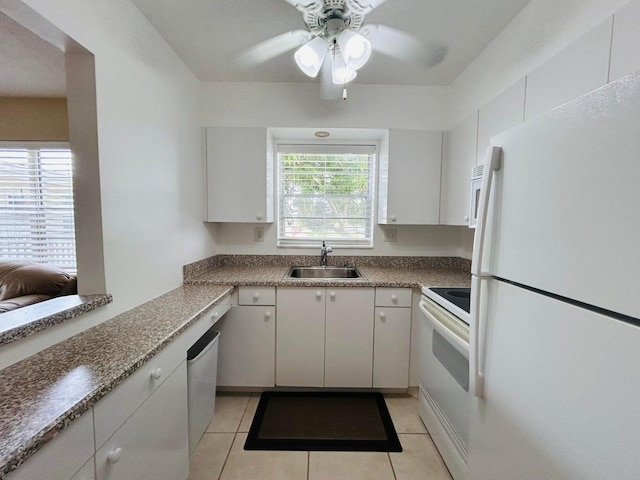 kitchen with white cabinetry, white appliances, and sink